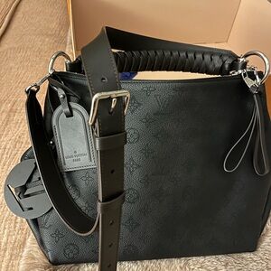 Louis Vuitton Beaubourg Hobo MM bag in Marina Calf Leather, braided handle.